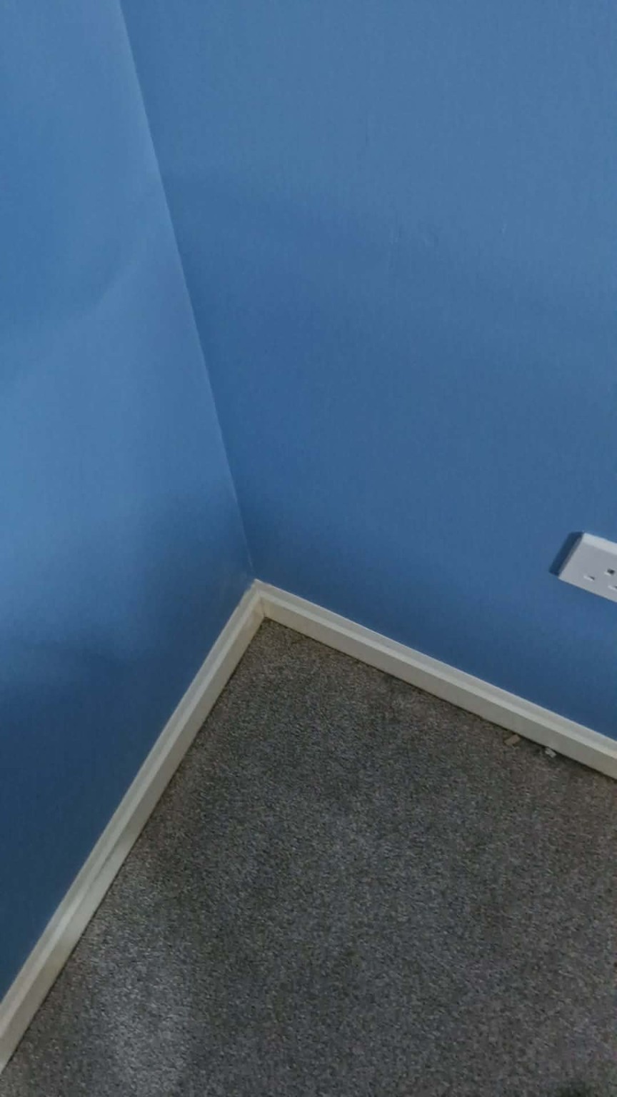 Bedroom after painting in a clean blue finish