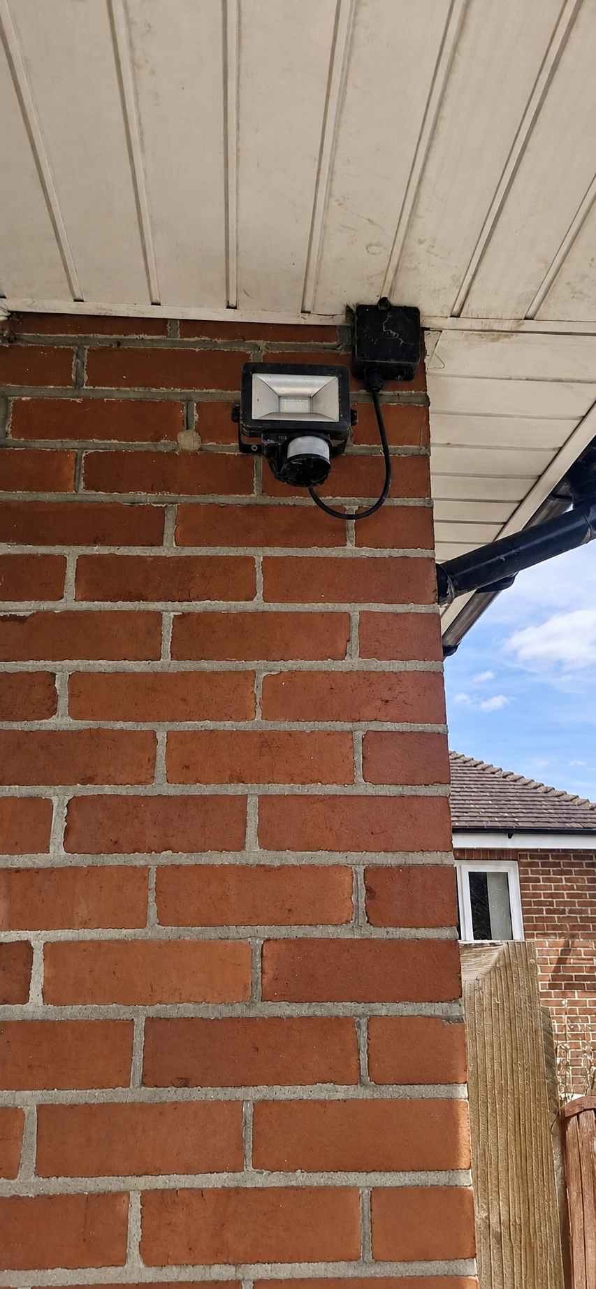 Old outdoor security light before replacement